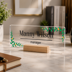 Transparent acrylic desk name plate: Manny Wilson, manager