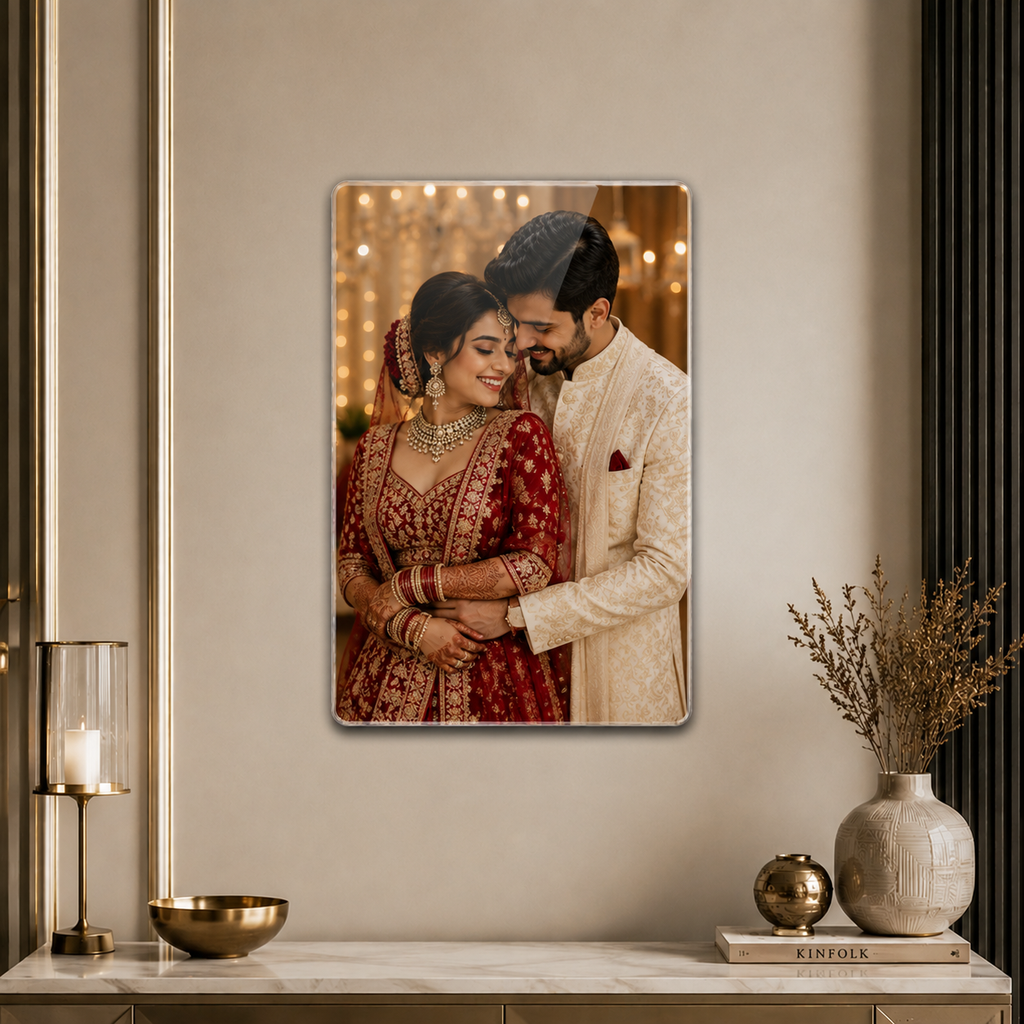 Crystal clear acrylic wall photo frame with a couple portrait inside, rounded corners.