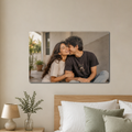 Acrylic landscape wall photo frame with couple photo, mounted above seating area