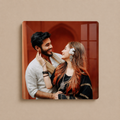 Square acrylic photo wall frame with rounded corners, featuring a smiling couple in traditional wear