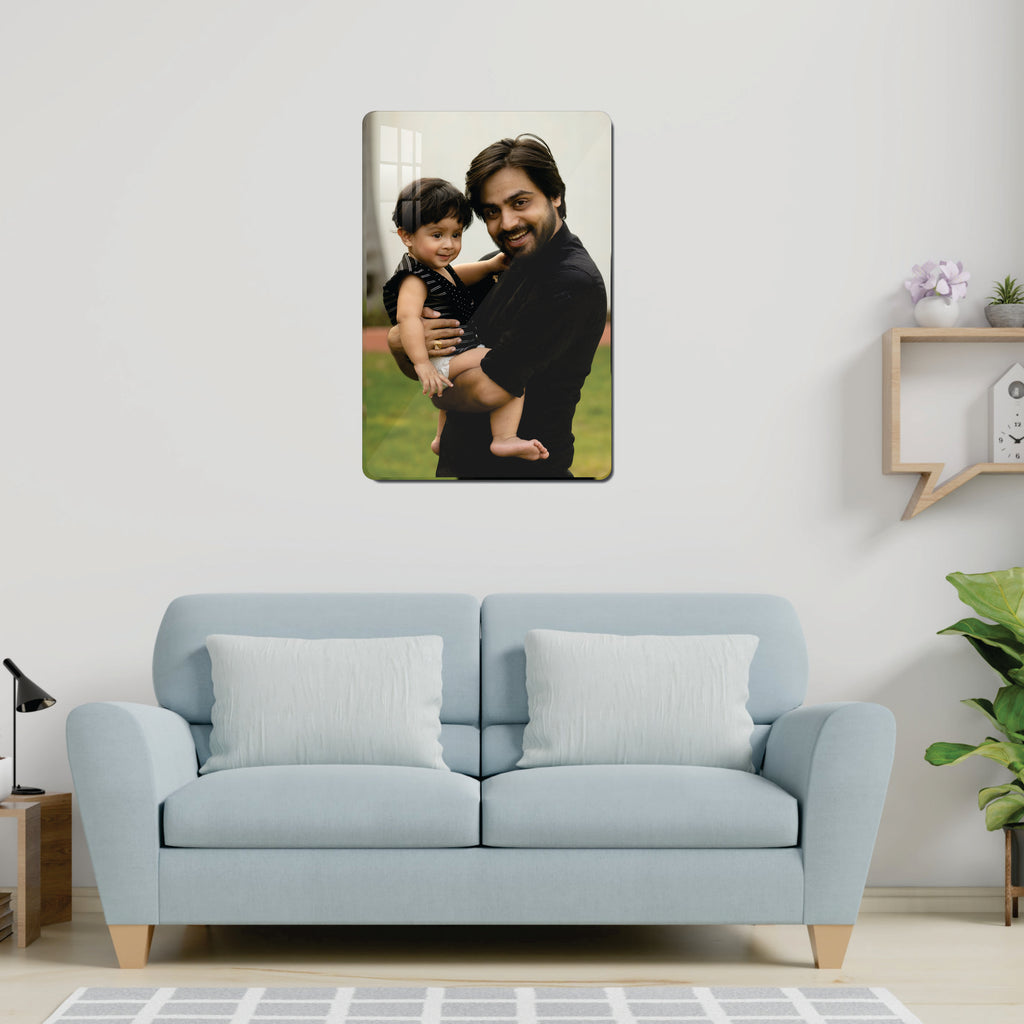 Crystal clear acrylic wall photo frame featuring a couple holding a baby portrait.