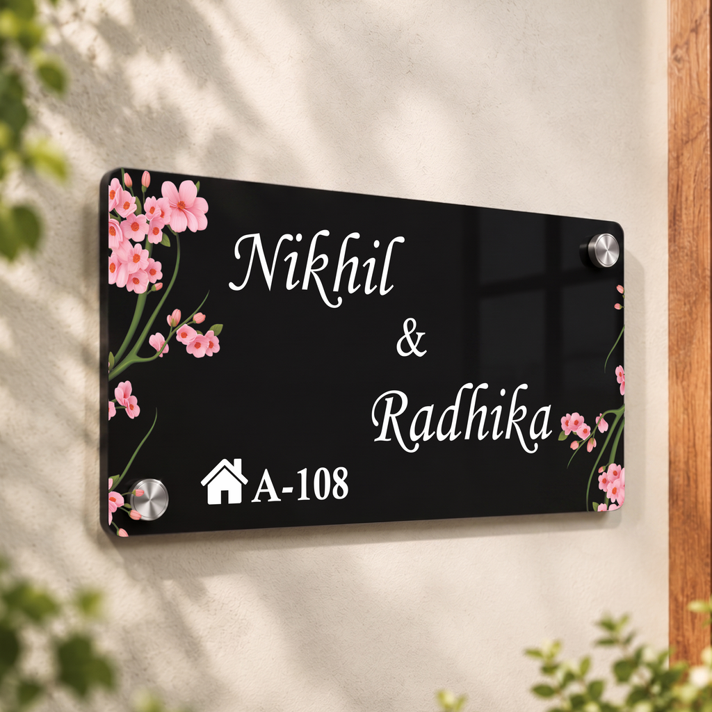 Black acrylic door name plate with cherry blossoms, Nikhil & Radhika, A-108; corner bolts