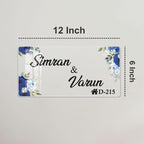 12 inch transparent acrylic door name plate: Simran & Varun, blue floral corners, D-215