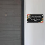 Black acrylic door name plate with floral border, Subramanian Varun & Simran D-58