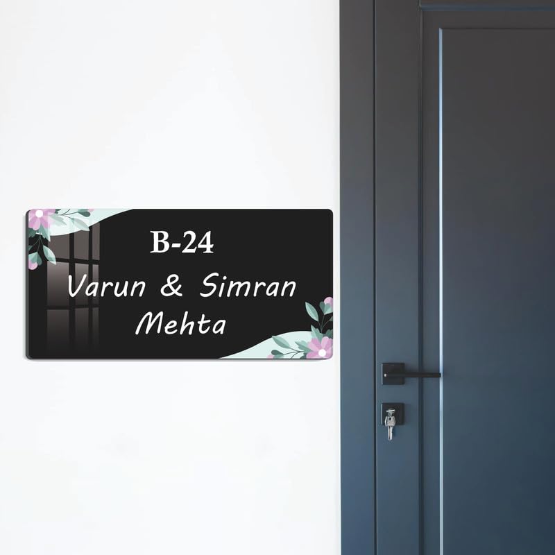 Wall-mounted black acrylic door name plate with floral corners, B-24 and Varun & Simran Mehta.