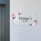 Transparent acrylic door name plate with pink floral border; Verma's C-57