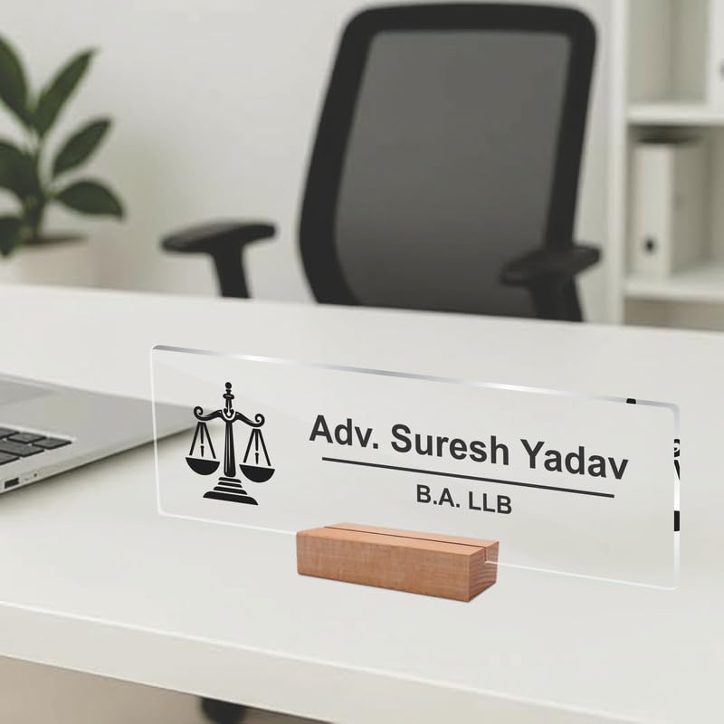 Transparent acrylic desk name plate showing scales icon, name text, and B.A. LLB
