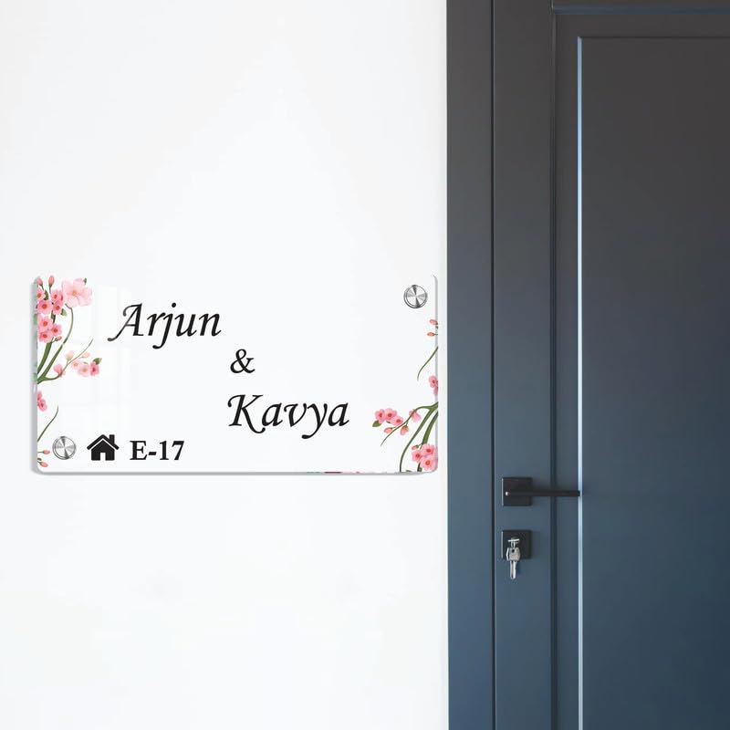 Transparent acrylic door name plate with cherry blossom design: Arjun & Kavya, E-17.