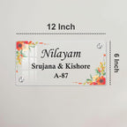 12-inch transparent acrylic door sign with floral border; names and A-87.