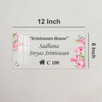 Transparent acrylic door name plate, 12 inch, with engraved “C 108” and pink floral corners