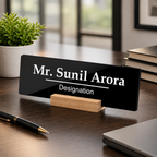 Black acrylic desk name plate with Mr. Sunil Arora and Designation on wooden stand