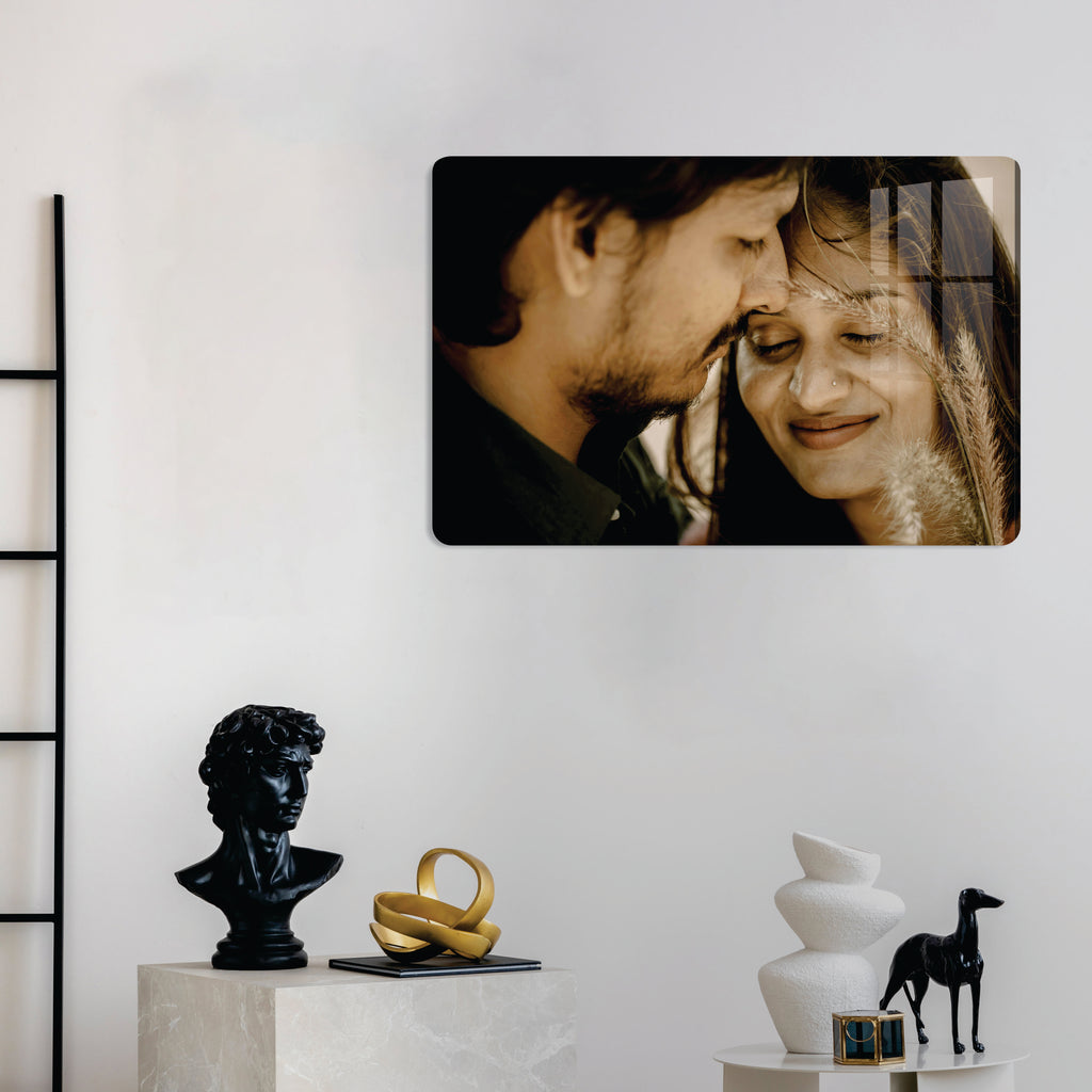 Glossy acrylic photo frame showing couple portrait, rounded rectangle with dark image