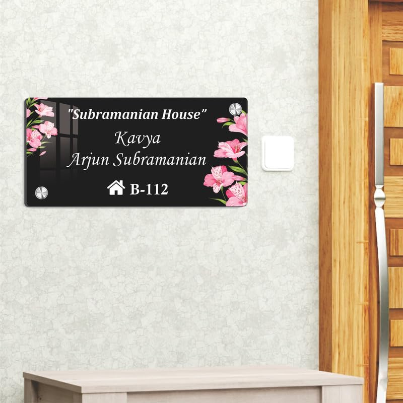 Black acrylic door name plate with floral corner accents, house number B-112