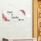 Transparent acrylic door name plate with floral red blossom border and engraved names
