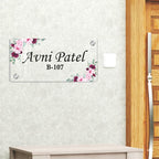 Transparent acrylic door name plate with pink floral border; Avni Patel B-107