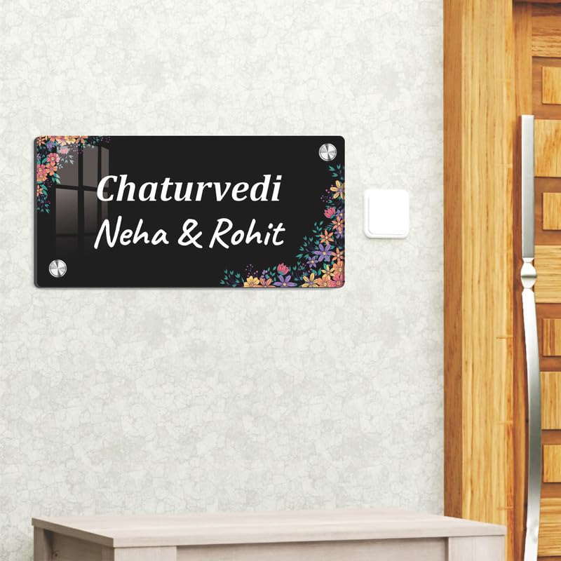 Black acrylic door name plate with floral corners, reads Chaturvedi, Neha & Rohit