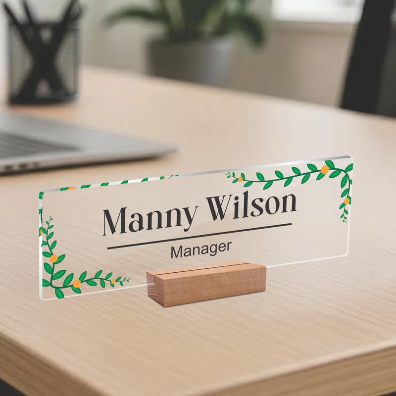 Transparent acrylic desk name plate: Manny Wilson, manager, green leaf border