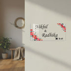 Transparent acrylic door name plate with floral red blossom border and engraved text