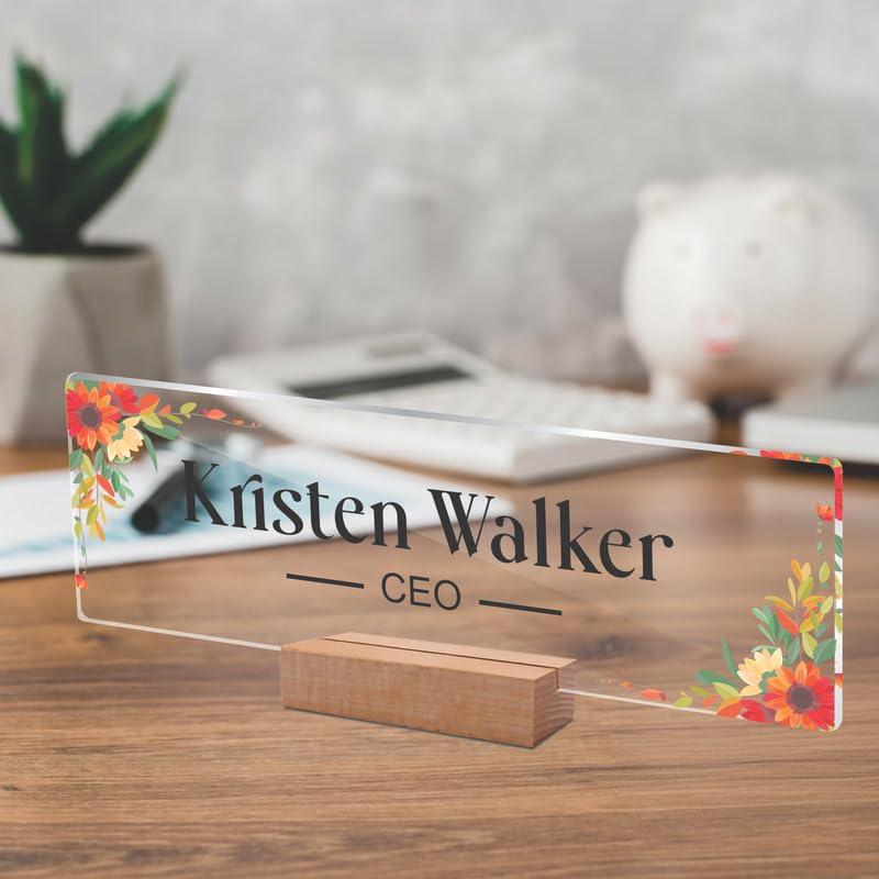 Transparent acrylic desk name plate, floral border, engraved name and CEO, on wooden stand