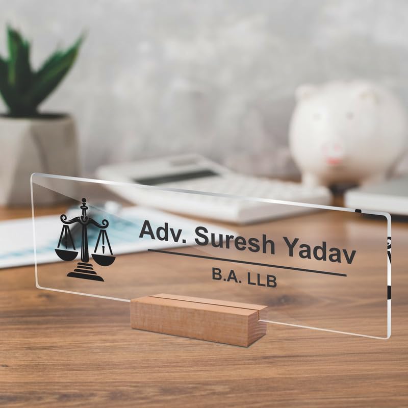Transparent acrylic desk name plate with scales icon, name text, and B.A. LLB