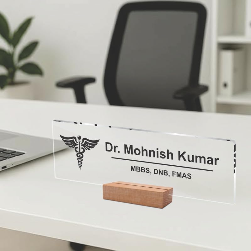 Transparent acrylic desk name plate with Dr. Mohnish Kumar and medical credentials, placed on desk