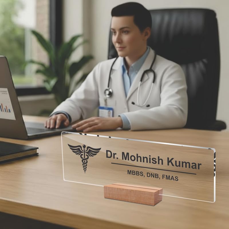 Transparent acrylic desk name plate with Dr. Mohnish Kumar and medical credentials, on wood stand