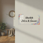 Transparent acrylic name plate with floral corners and engraved “Sheikh Zehra & Sameer”