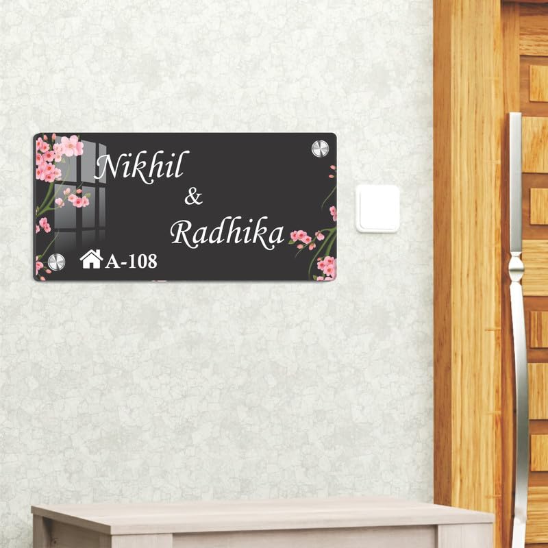 Black acrylic door name plate with cherry blossoms, Nikhil & Radhika, A-108; wall mounted