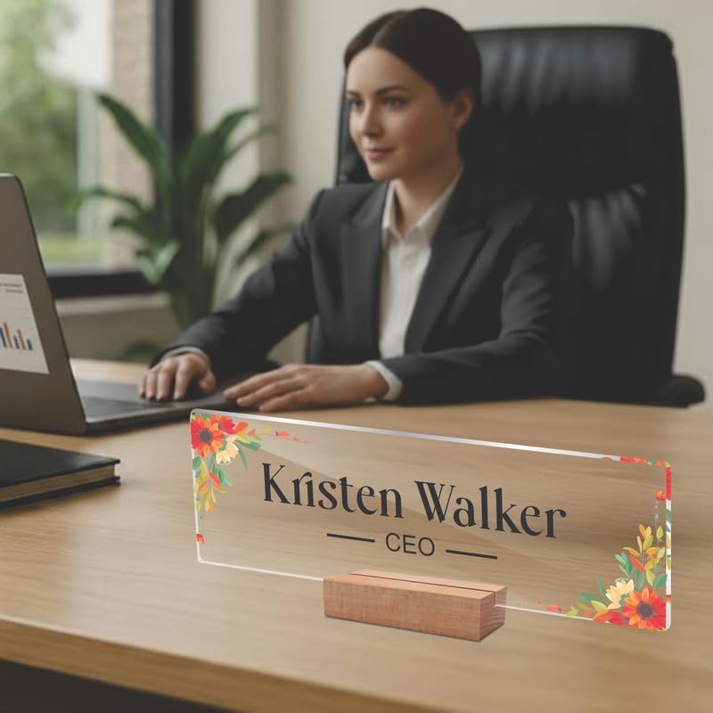 Transparent acrylic desk name plate with floral border, engraved name and CEO, on wooden stand