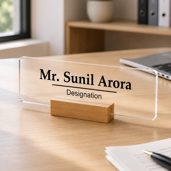 Transparent acrylic desk name plate with engraved “Mr. Sunil Arora” and Designation