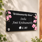 Black acrylic door name plate with floral corner accents, house number C-307