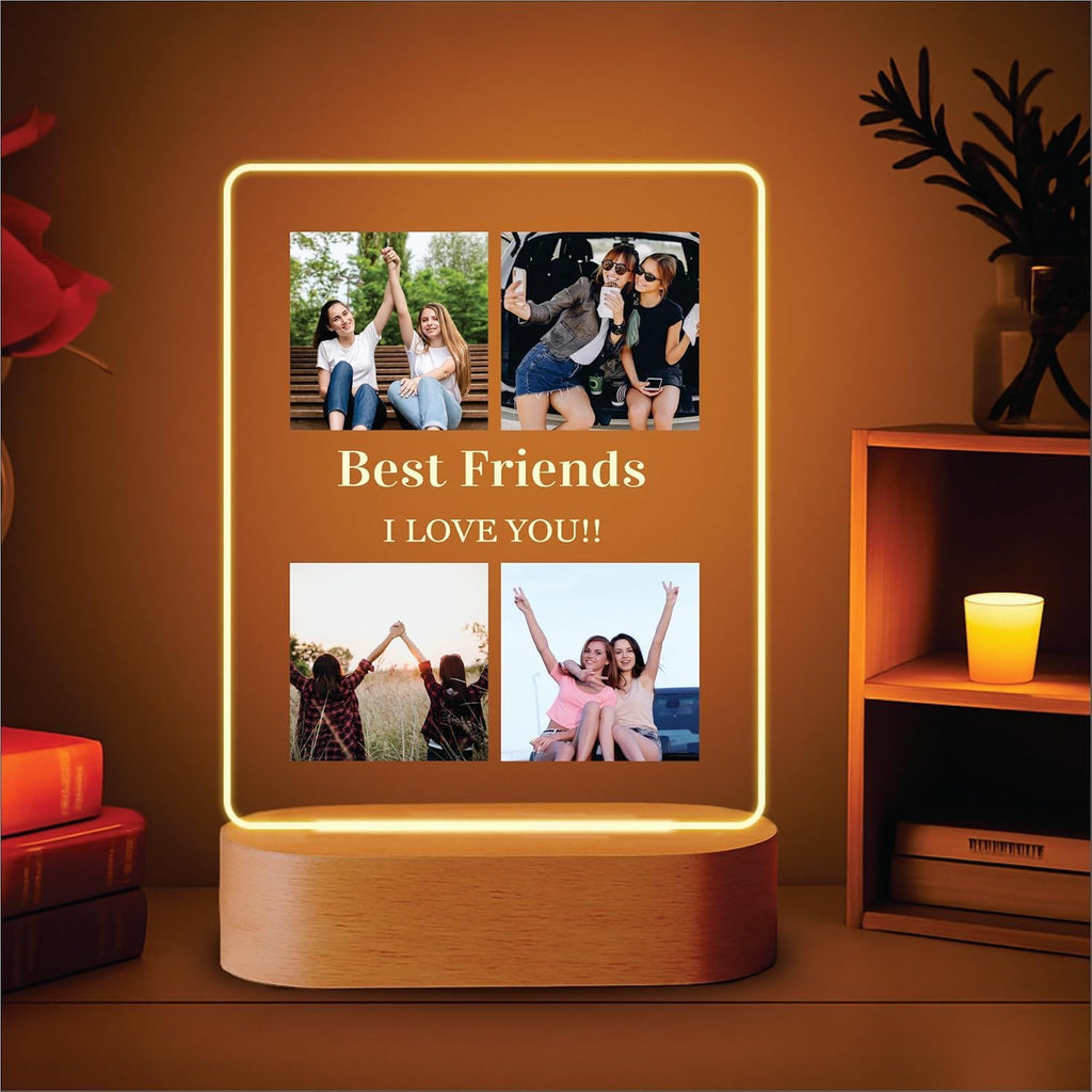 LED acrylic photo frame with four photos and warm glowing border, on wood base