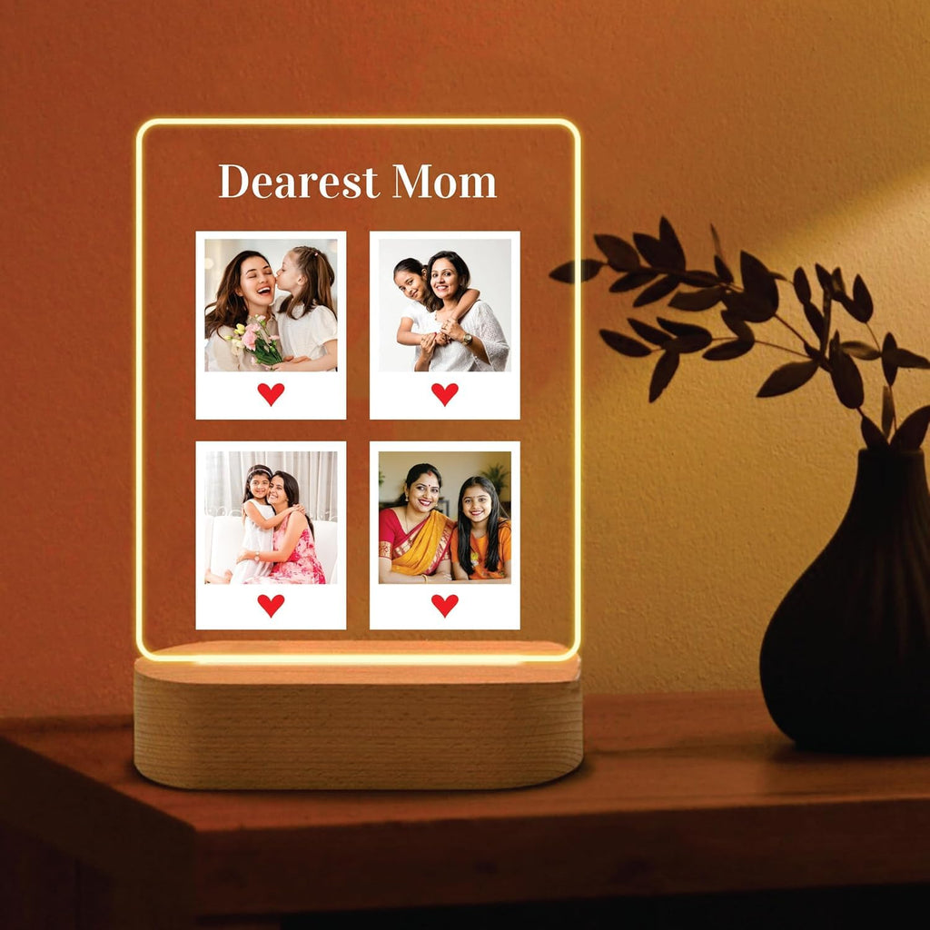 Edge-lit LED acrylic photo frame with four portrait tiles, warm glow, and wood base