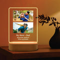 Vertical LED acrylic photo frame with two portrait photos, warm glow outline, wood base