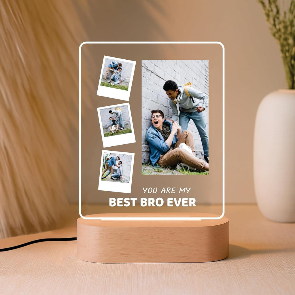 LED acrylic photo frame with three small photos and one large photo, on wood base.