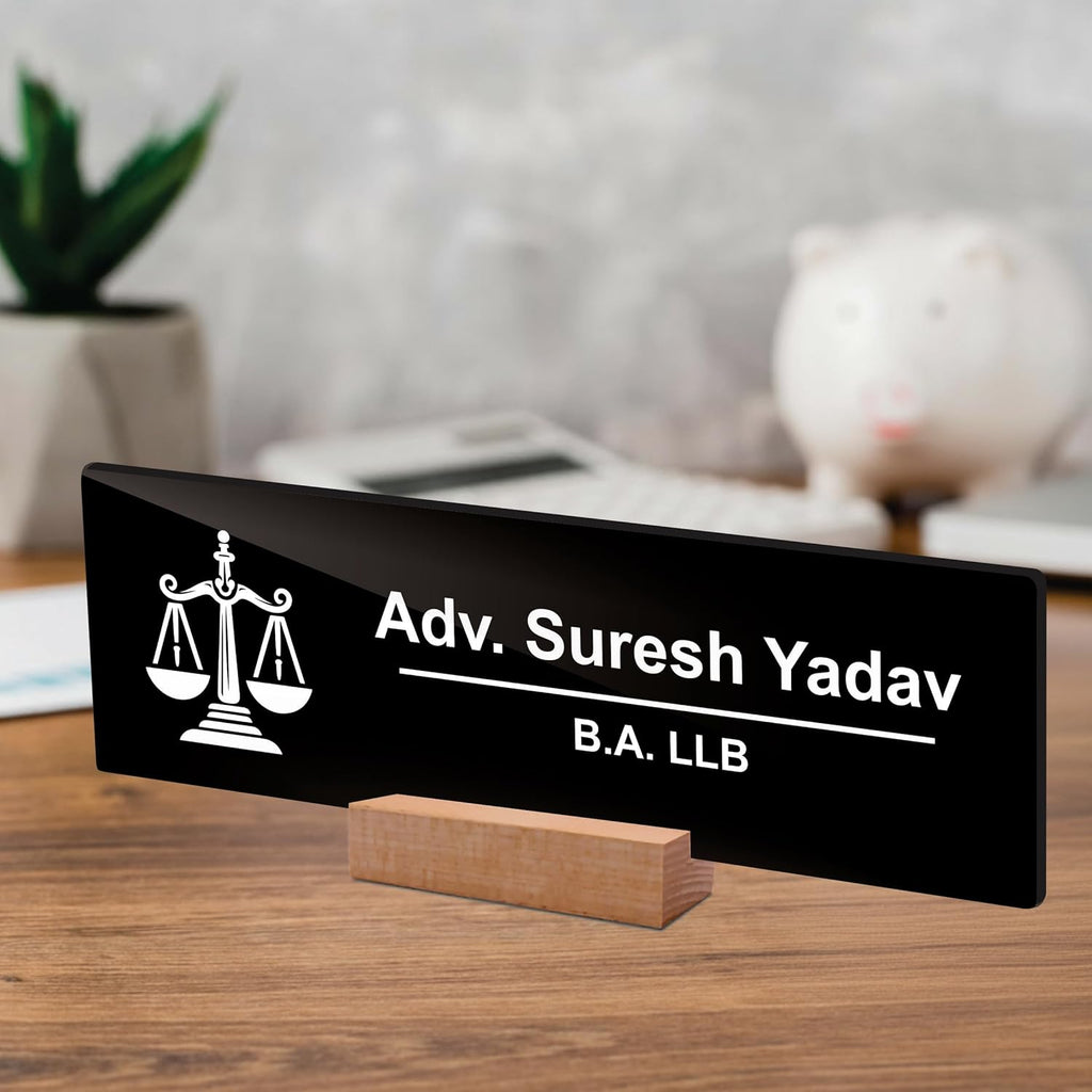 Black acrylic desk plate on wood stand with scales icon: Adv. Suresh Yadav, B.A. LLB