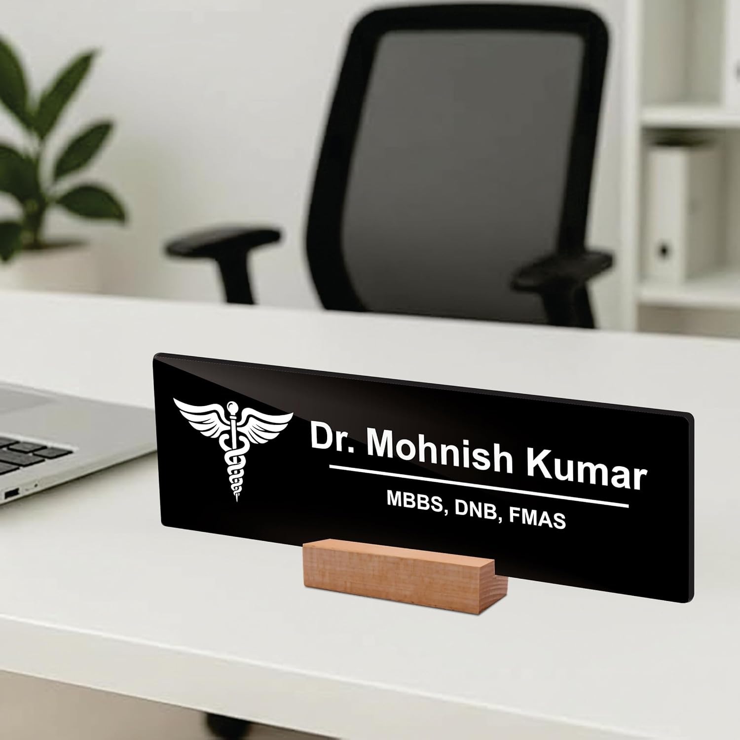 Black acrylic desk name plate with white doctor name and caduceus, with wooden stand