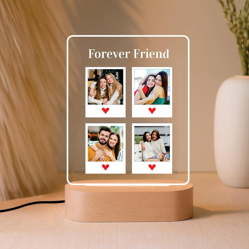 Edge-lit LED acrylic photo frame with four photo tiles and warm glow, round wood base