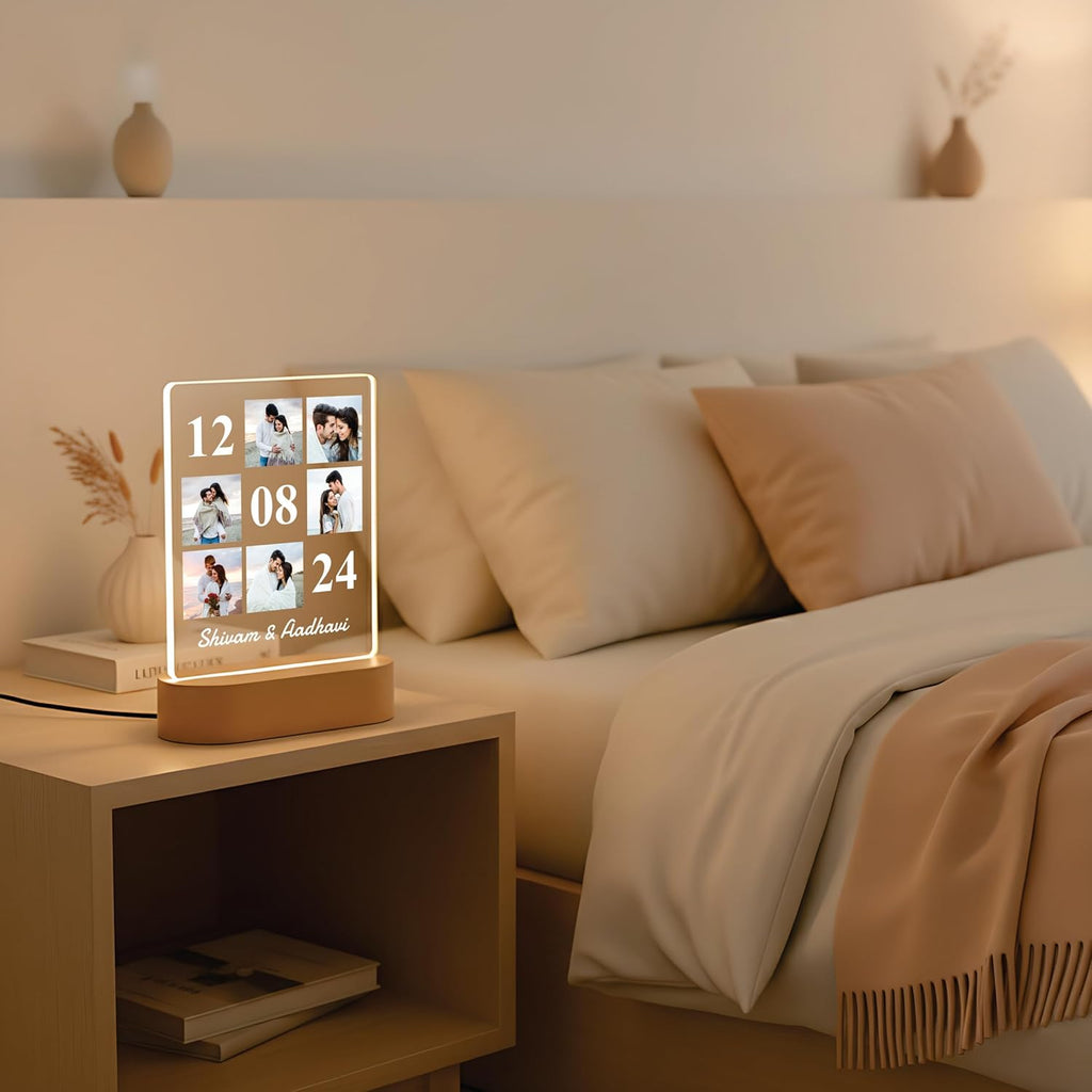 LED acrylic photo frame with 3 photo slots, glowing white outline on a bedside table