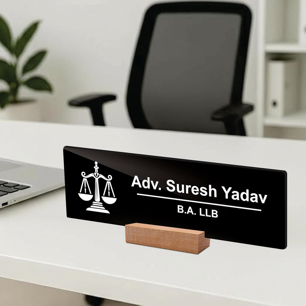 Black acrylic desk plate at angle with scales icon on wood stand: Adv. Suresh Yadav, B.A. LLB