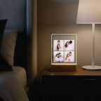 LED acrylic photo frame with warm glowing border and four-photo collage on wood base