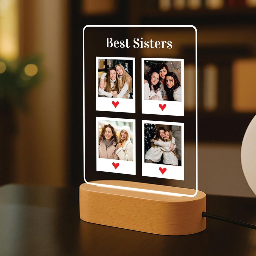 Edge-lit LED acrylic photo frame with four portrait tiles, warm outline light, wood base