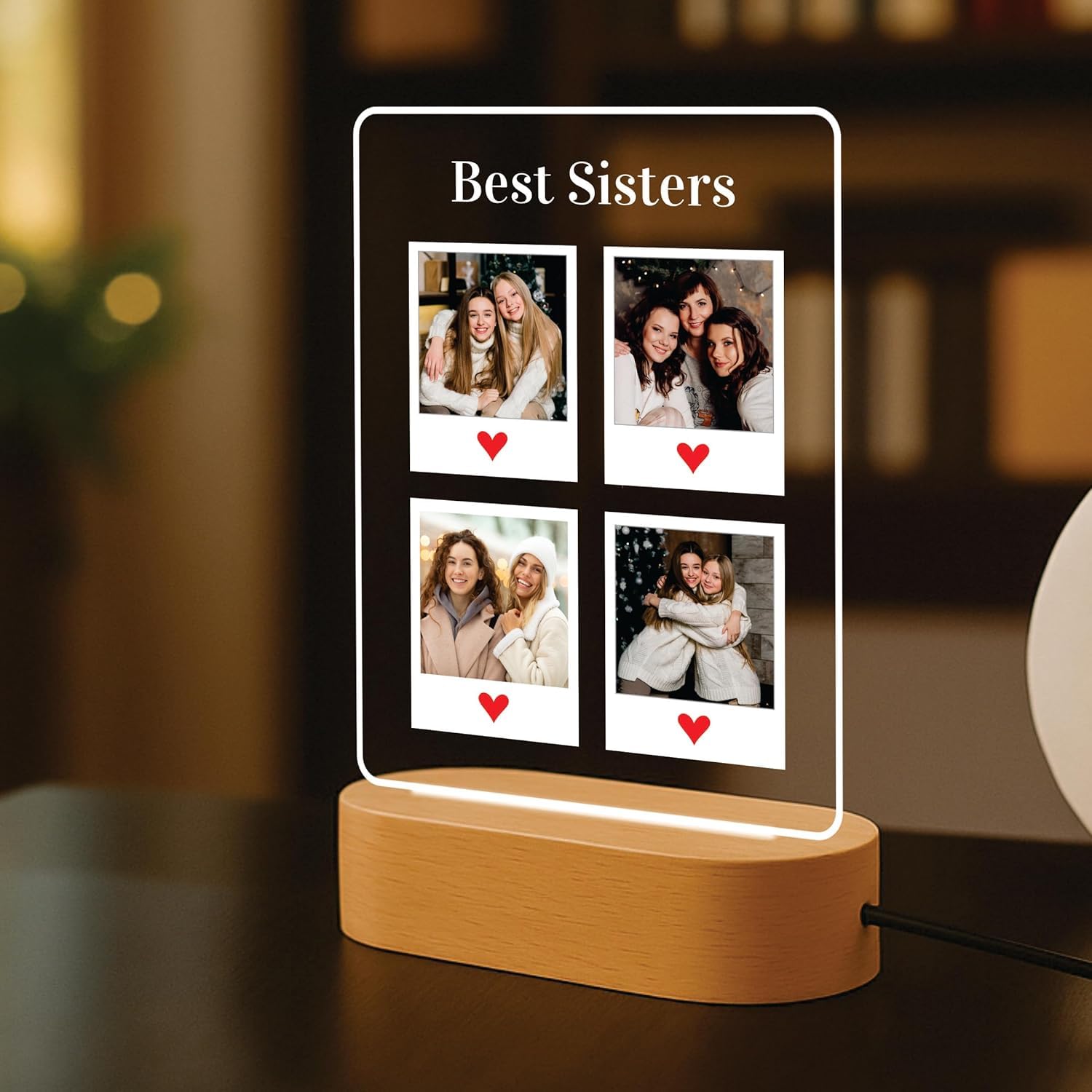 Edge-lit LED acrylic photo frame with four portrait tiles, warm outline light, wood base