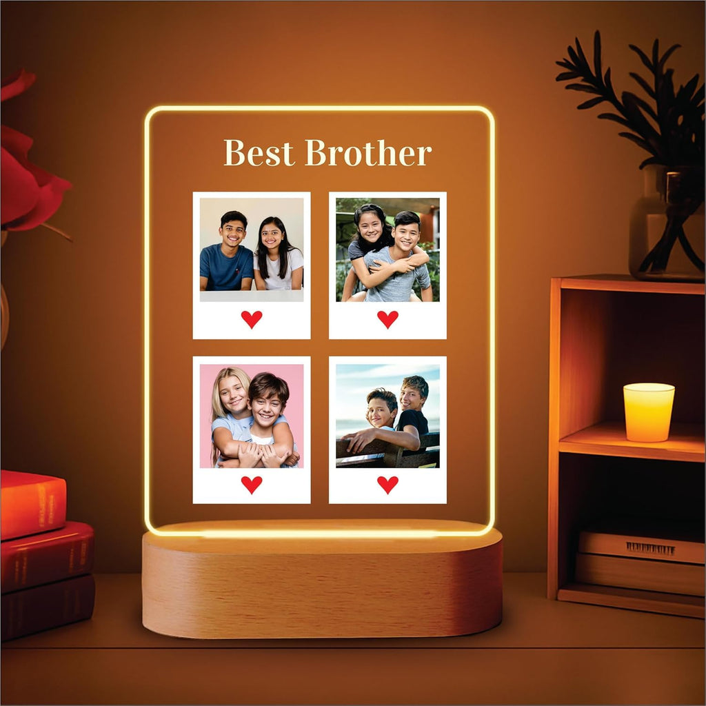 Edge-lit LED acrylic photo frame with four portrait tiles and warm glow, on wood base