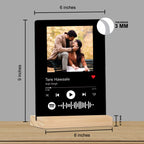 Black acrylic photo frame on wooden stand showing 6-inch size and 3mm thickness