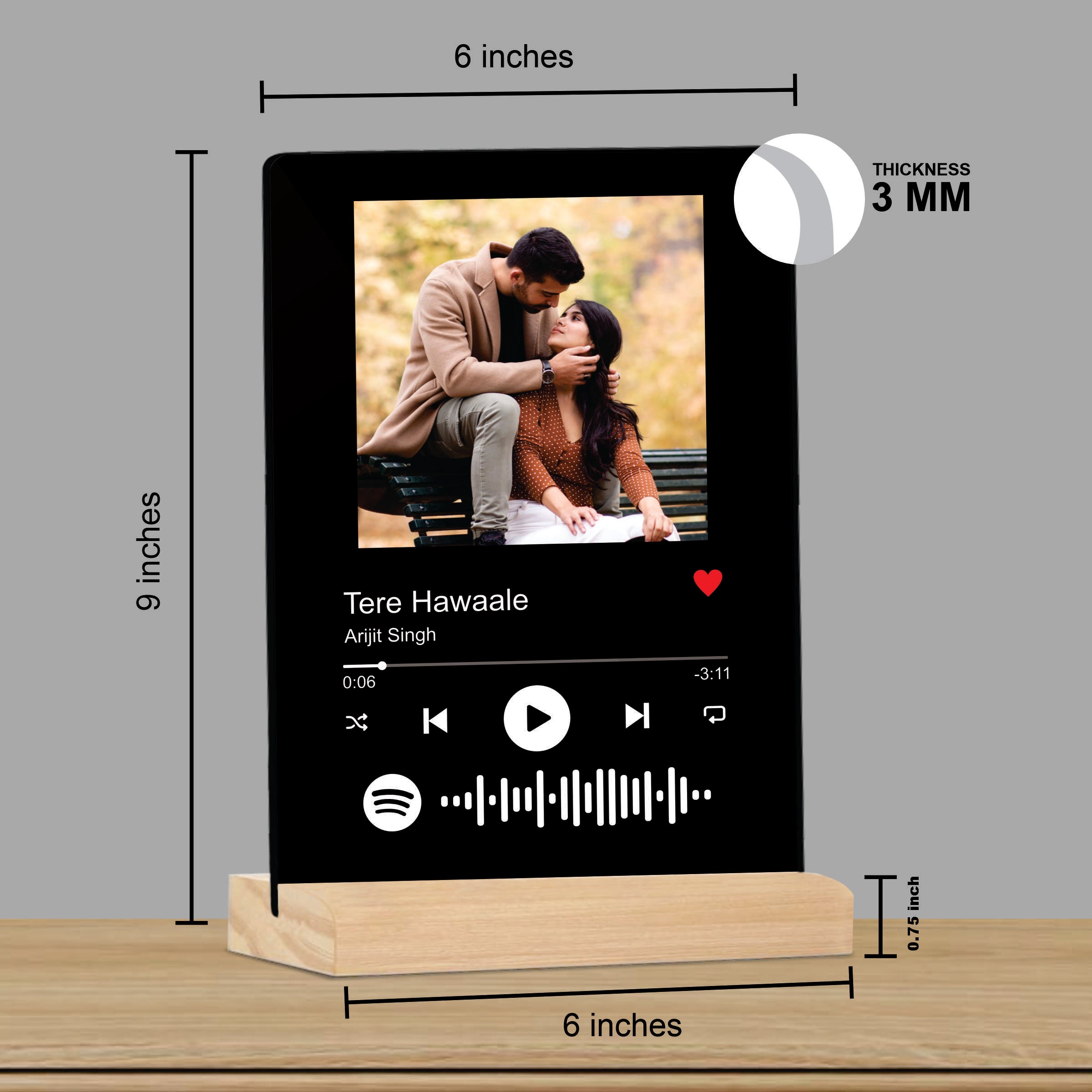 Black acrylic photo frame on wooden stand showing 6-inch size and 3mm thickness