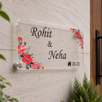 Transparent acrylic door name plate with floral red blossom border and name text, mounted