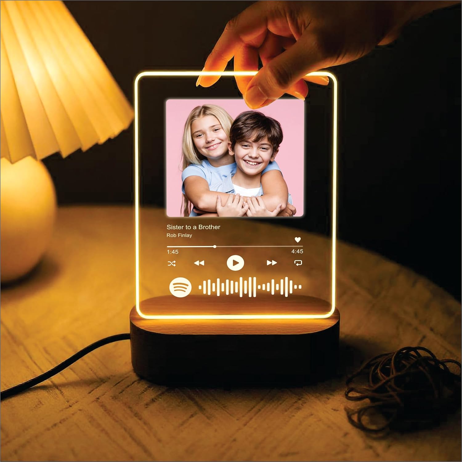 Glowing acrylic photo music frame with a small photo inside and touch control glow