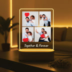 LED acrylic photo frame on wood base with four photos, red hearts, and glowing border