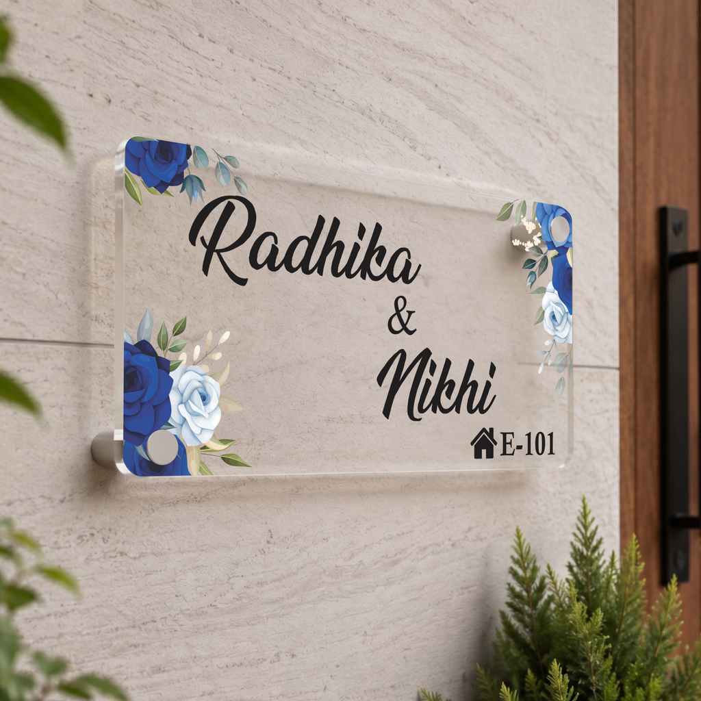 Transparent acrylic door name plate: Radhika & Nidhi, blue floral corners, E-101